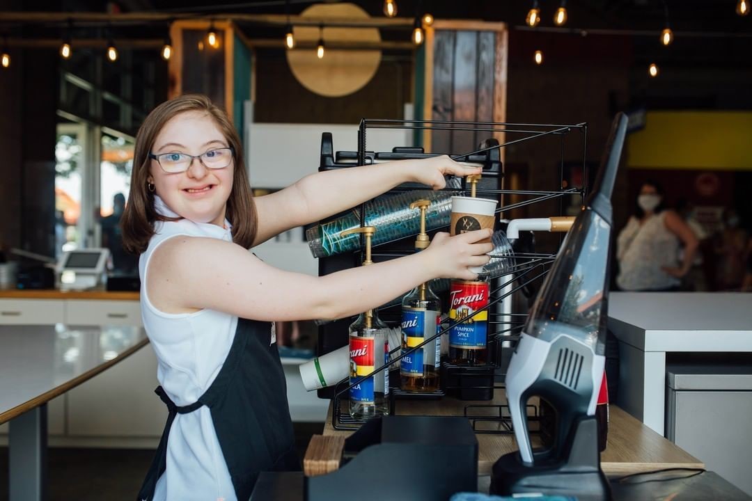 Barista making a drink in a cafe